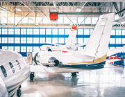 Business jets in hangar