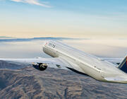 Delta Air Lines plane flying over mountains