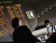 Paris airport travelers with masks