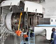 airline mechanics inspecting engine
