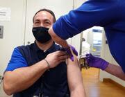 United Airlines ramp services worker receives COVID-19 vaccine
