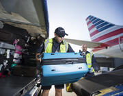 American Airlines fleet team unloading baggage
