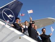 Lufthansa crew waving American flags