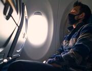 passenger with mask sleeping