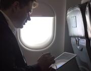 airplane passenger with tablet