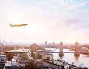 Aircraft flies over the London Bridge