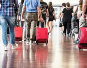 travelers with suitcases