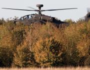apache helicopter behind trees