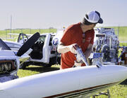 Pilot refuels piston-engine aircraft