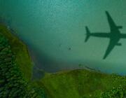 plane shadow over water