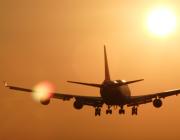 Aircraft landing into the sunset