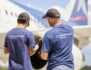 Lufthansa Technik employees using a tablet