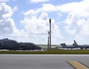 U.S. Air Force C-17s, left, along with a Royal Air Force Voyager and other international aircraft at Andersen Air Force Base, Guam