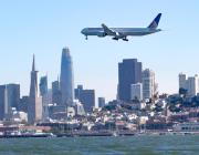united airlines jet over San Francisco