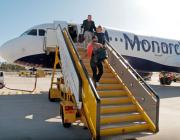 monarch airlines jet passengers disembarking
