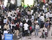 A Beijing Capital International Airport departure lobby is crowded with people flying out of the Chinese capital on Sept. 29, 2023