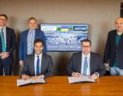 officials at Kyiv airport signing