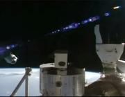 The SpaceX Dragon Freedom spacecraft (left) backs away from the space station carrying four Axiom Mission 3 astronauts