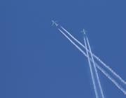 Two aircraft leave behind contrails