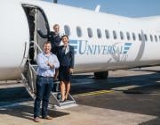 simon cook in front of universal air plane on tarmac