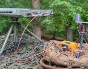 OneWeb Astra system atop military backpack in forest