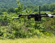 Drone flying through forested area