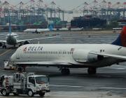 Delta Air Lines and other aircraft lining up at airport