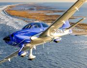 Cirrus SR-22 G7 flies over water