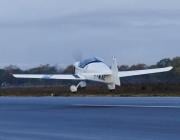 Aura Aero Integral E trainer flies over water