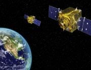 Two satellites in orbit over Earth