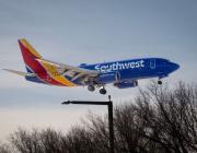 SWA jet landing at Midway