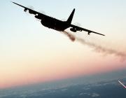 aircraft in flight at sunset