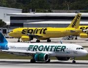 Frontier Airlines and Spirit Airlines aircraft on runway