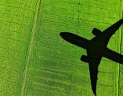 airplane flying over field