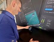 Seneca Giese, Cirrus director of Cirrus IQ products and services, demonstrates the apps at its exhibit at Sun ‘n Fun Aerospace Expo 2025.