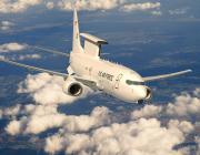Rendering of Boeing E-7 aircraft flying above clouds