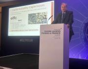 conference speaker addressing audience from the podium 