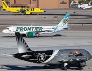 Three Airbus jets on runway, from top: Spirit Airlines, Frontier, Allegiant