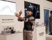 A person wearing the X-ble Shoulder device