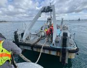 Navay salvage ship with aircraft wreckage