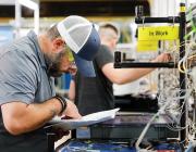 Employee looking over paper instructions
