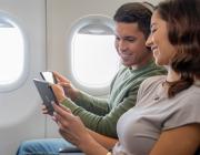 passengers looking at their iPads 