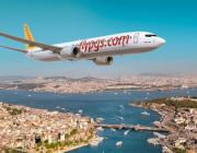 Pegasus Airlines jet flying over city