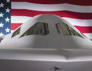 Close-up of B-21 bomber against U.S. flag