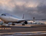 delta jet on the ground with control tower in background