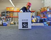 Sales representative packs an order