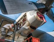 military-trained mechanic working on aircraft