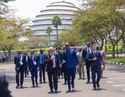 Rwandan President Paul Kagame walks with Aviation Africa chairman Alan Peaford to see EHang’s eVTOL demonstration flight with the Kigali Convention Center in the background.