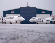 Aircraft in front of a Taby Air Maintenance facility
