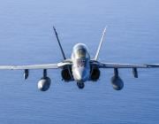 F/A-18 flying over sea